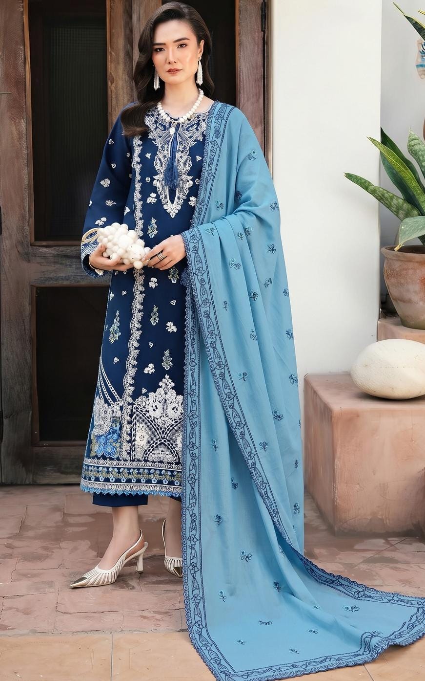 Model wearing Hussain Rehar article 2307 in navy blue with a sky-blue dupatta